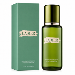 La Mer treatment lotion bottle and packaging on a white background